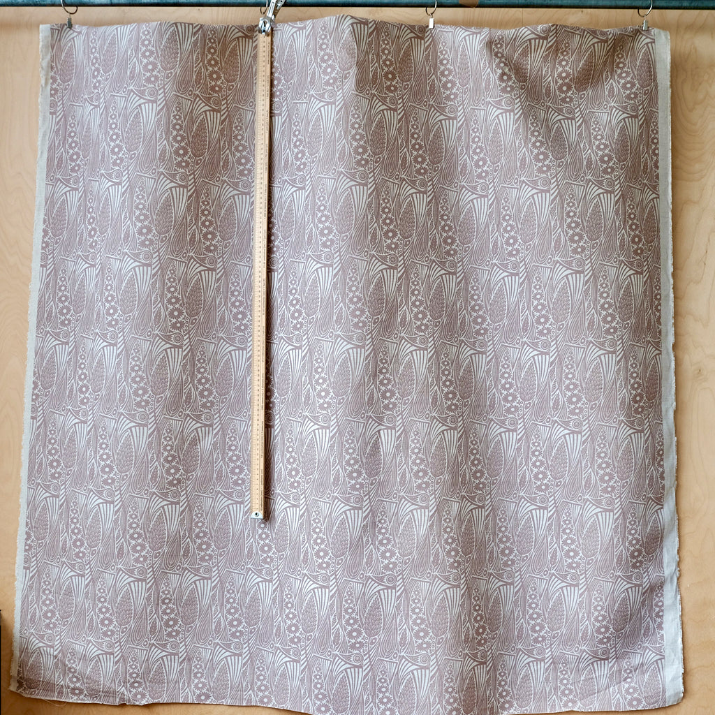 Meadow Grass fabric length in smoky pink.
