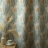 printed fabric with sun and tree motif on natural linen