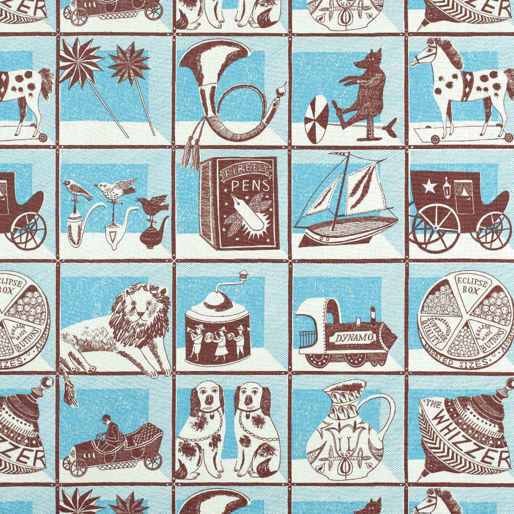 A repeating vintage-style nursery or children's pattern featuring illustrated toys and objects such as a lion, carousel, train, dogs, horn, sailboat, horse, and circus scenes, arranged in a grid on a light blue and off-white background.
