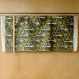 navy, white, ochre printed fabric in front of a plywood board