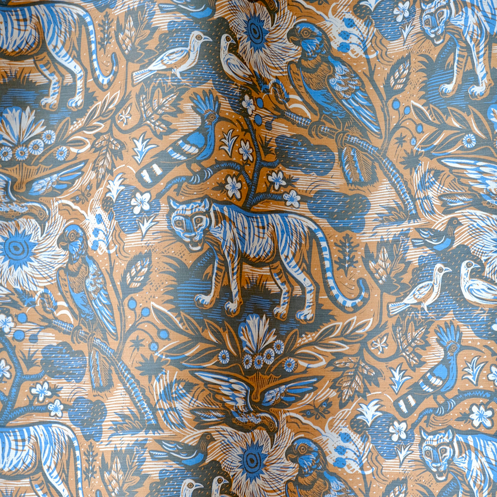 Blue and orange fabric with tiger, parrot, birds and plant designs