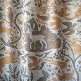 animal and bird motifs printed on grey linen fabric