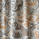animal and bird motifs printed on grey linen fabric